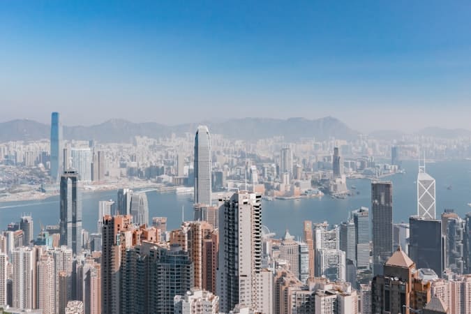 Hong Kong skyline showing the financial district, one side of the Singapore vs Hong Kong bank account decision for non-residents