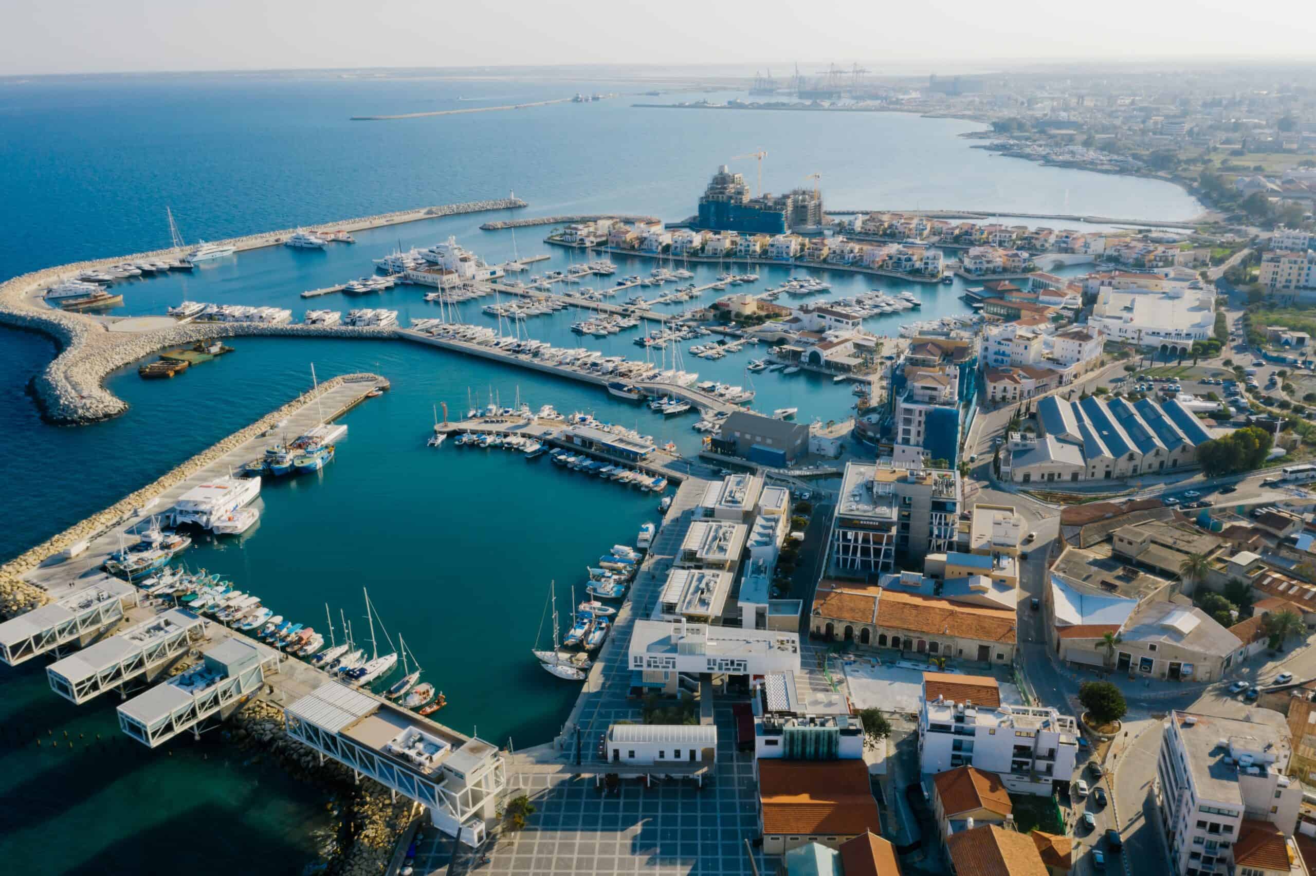 Aerial view of a Cyprus coastal harbor town, home to the 60-day tax residency rule