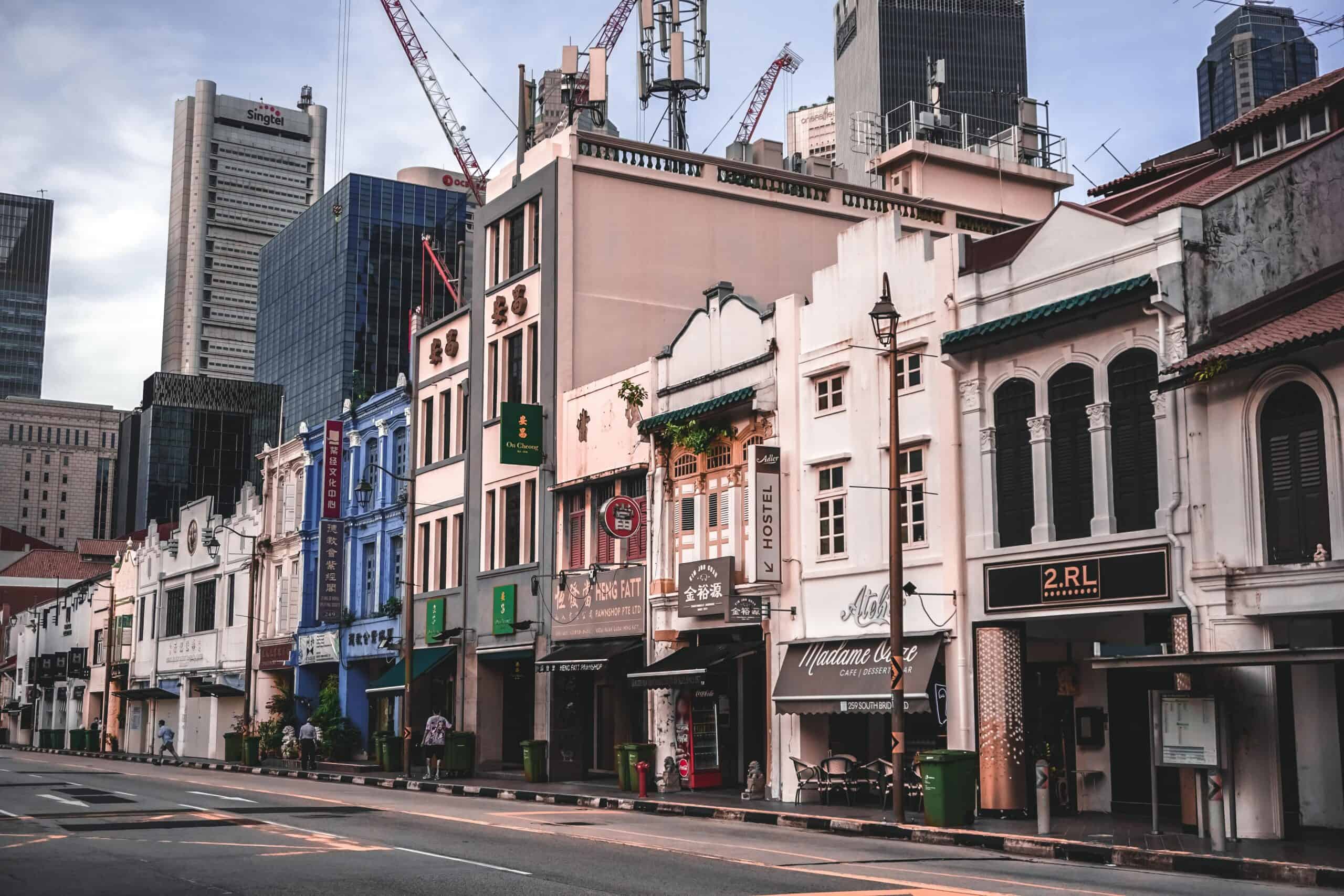Singapore street representing tax exemption scheme documents and YA 2026 rebate stacking rules