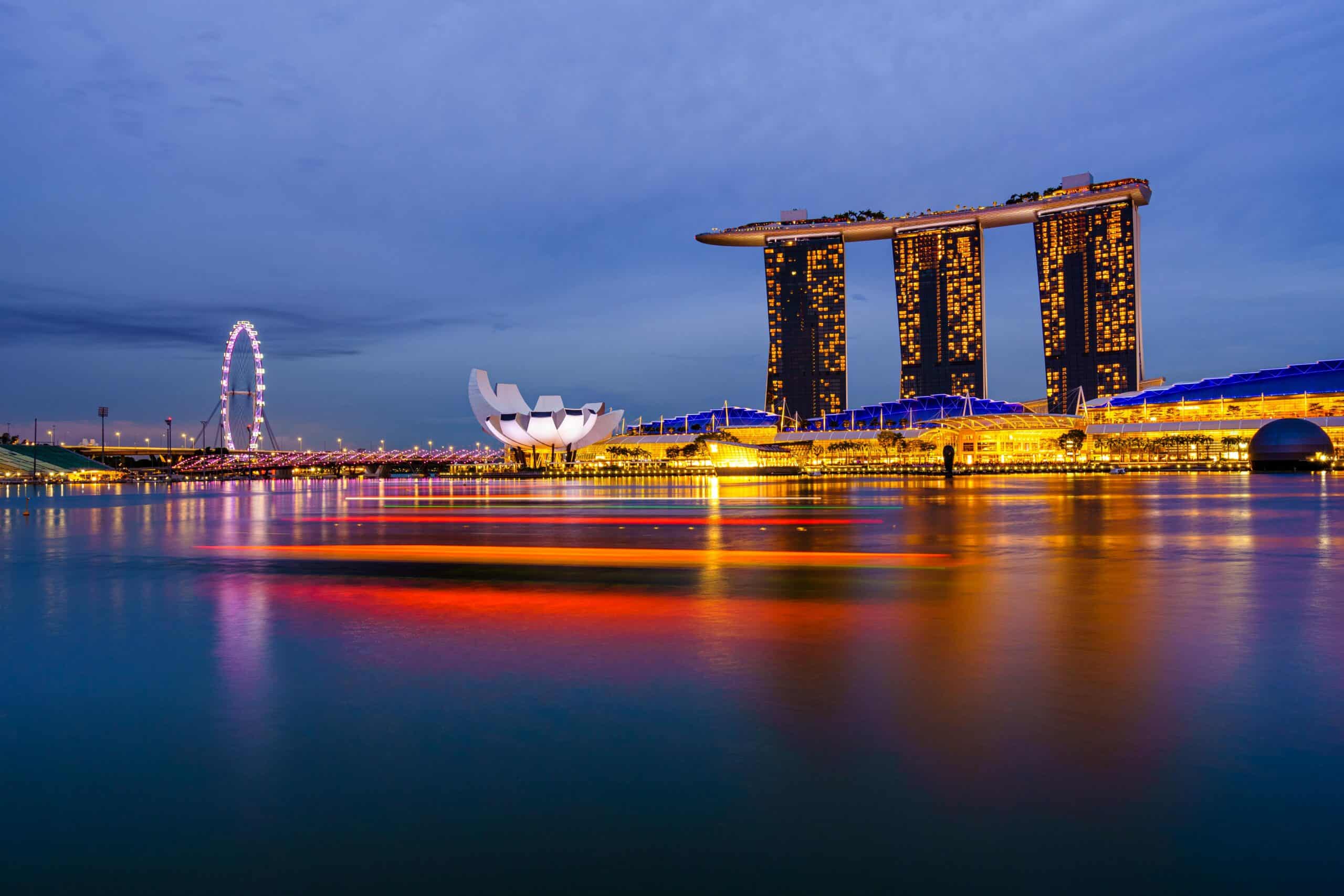 Singapore skyscrapers at night reflecting structuring considerations for foreign entrepreneurs