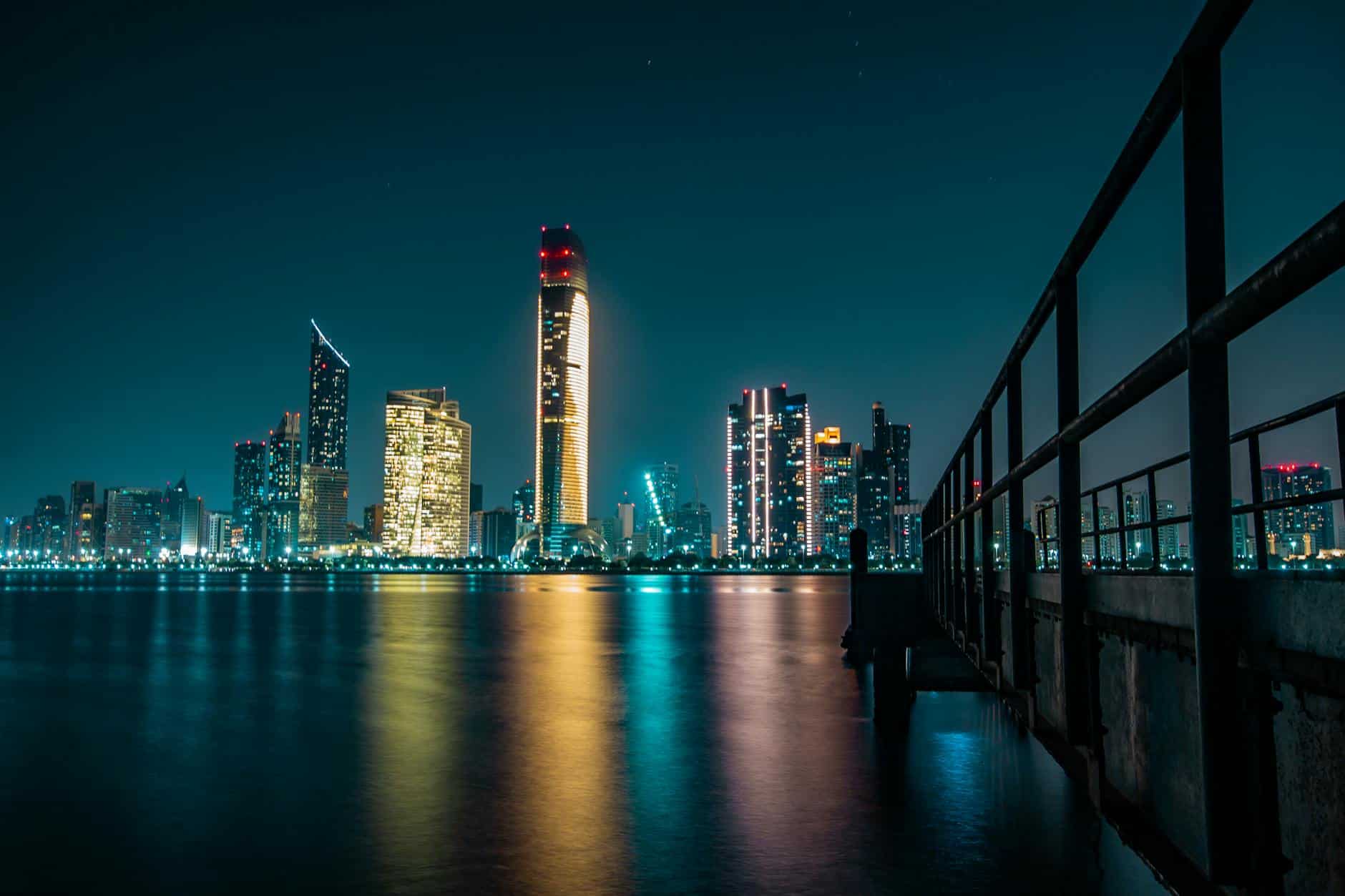 Abu Dhabi waterfront skyline highlighting business environment advantages over Dubai