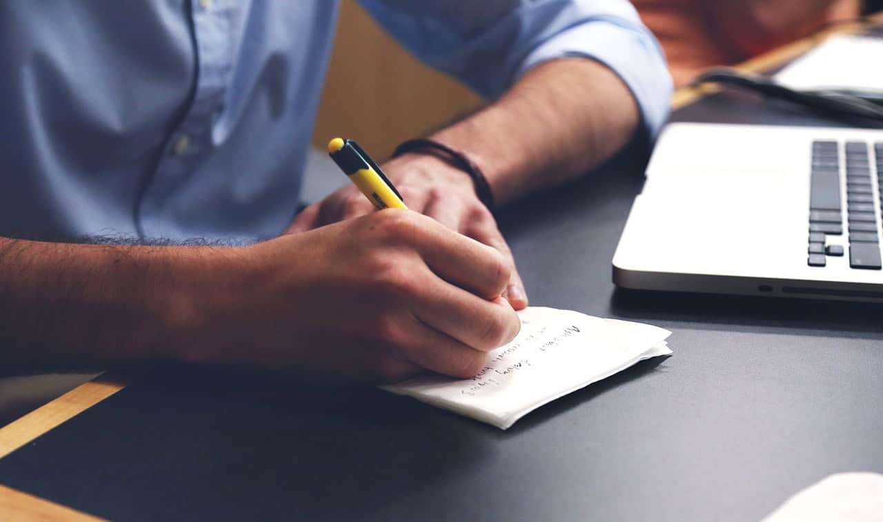Entrepreneur writing a 90-day Singapore for entrepreneurs business launch action plan