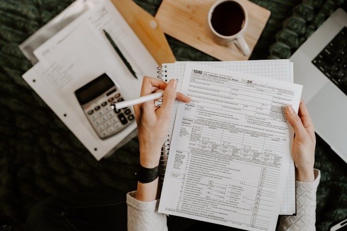 Entrepreneur calculating corporate tax obligations and compliance requirements in Dubai