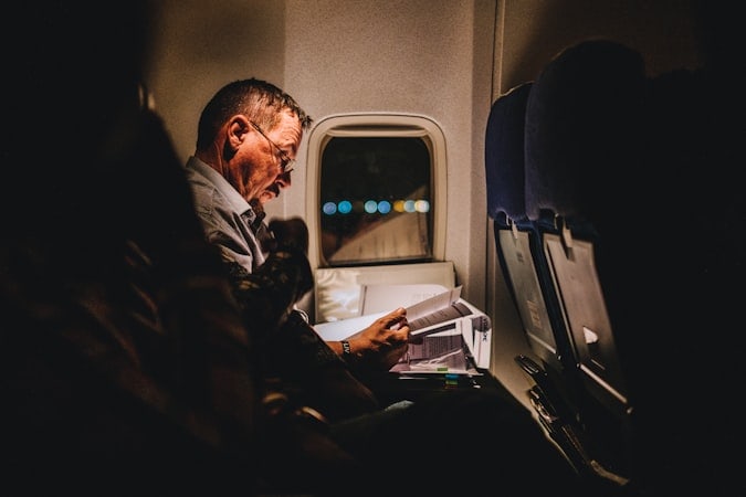 Frequent traveler on plane navigating 183-day rule exceptions and planning pitfalls