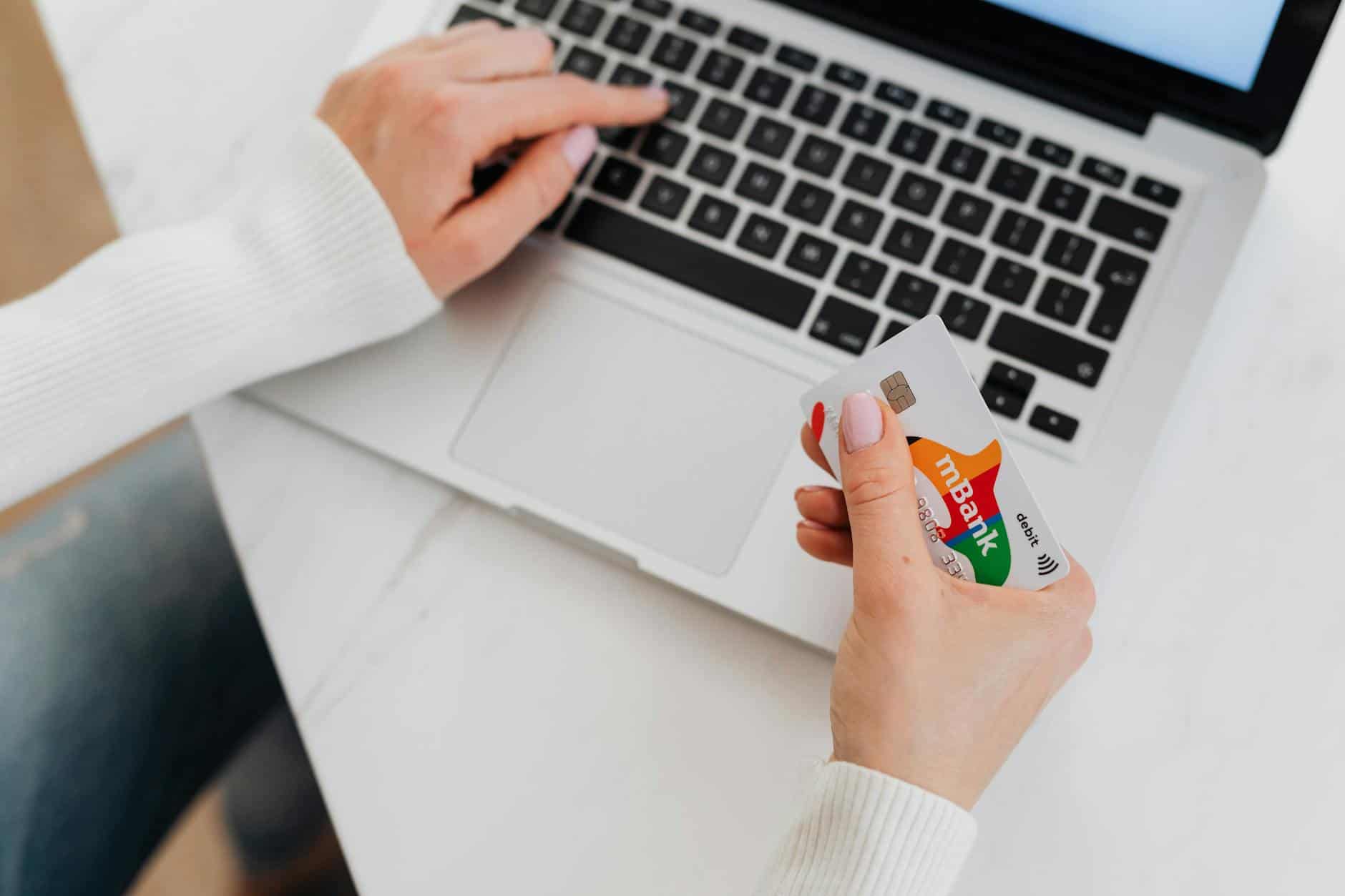 Entrepreneur managing online payments across international business banking setups
