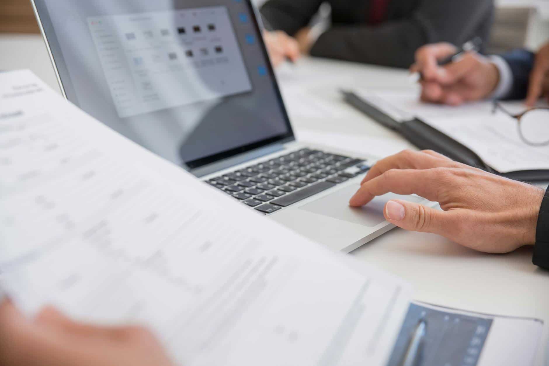 Compliance team analyzing CARF crypto asset reporting obligations and privacy implications