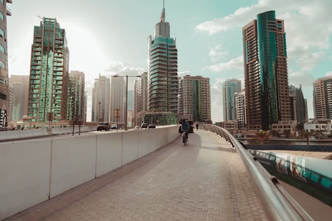 Entrepreneur cycling through Dubai during 90-day business setup action plan
