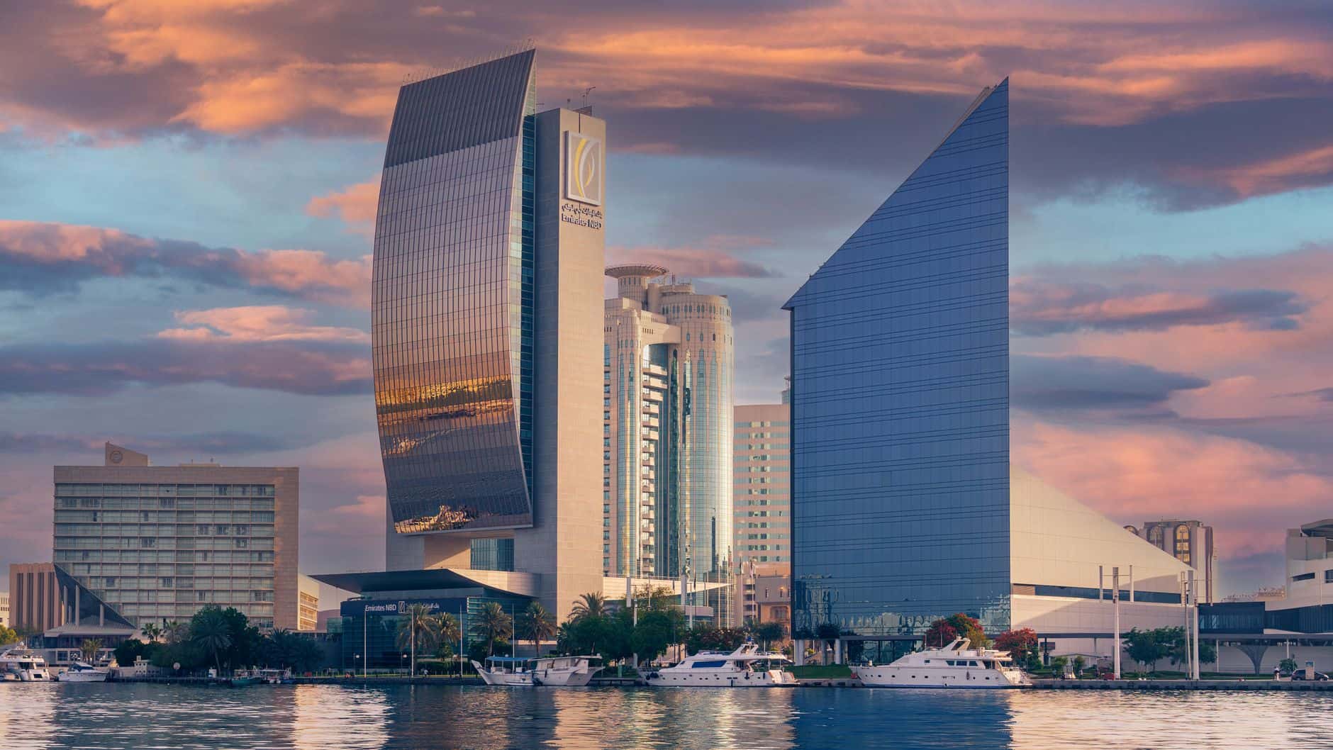 Dubai modern skyscrapers at sunset illustrating free zone vs mainland business decisions