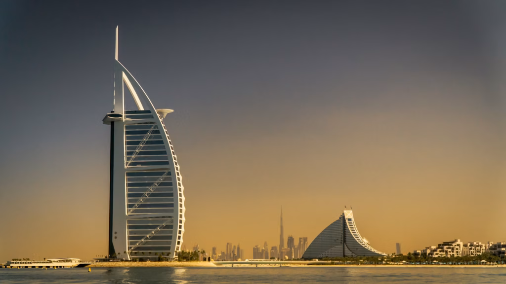 Burj Al Arab hotel Dubai with modern skyline at golden hour