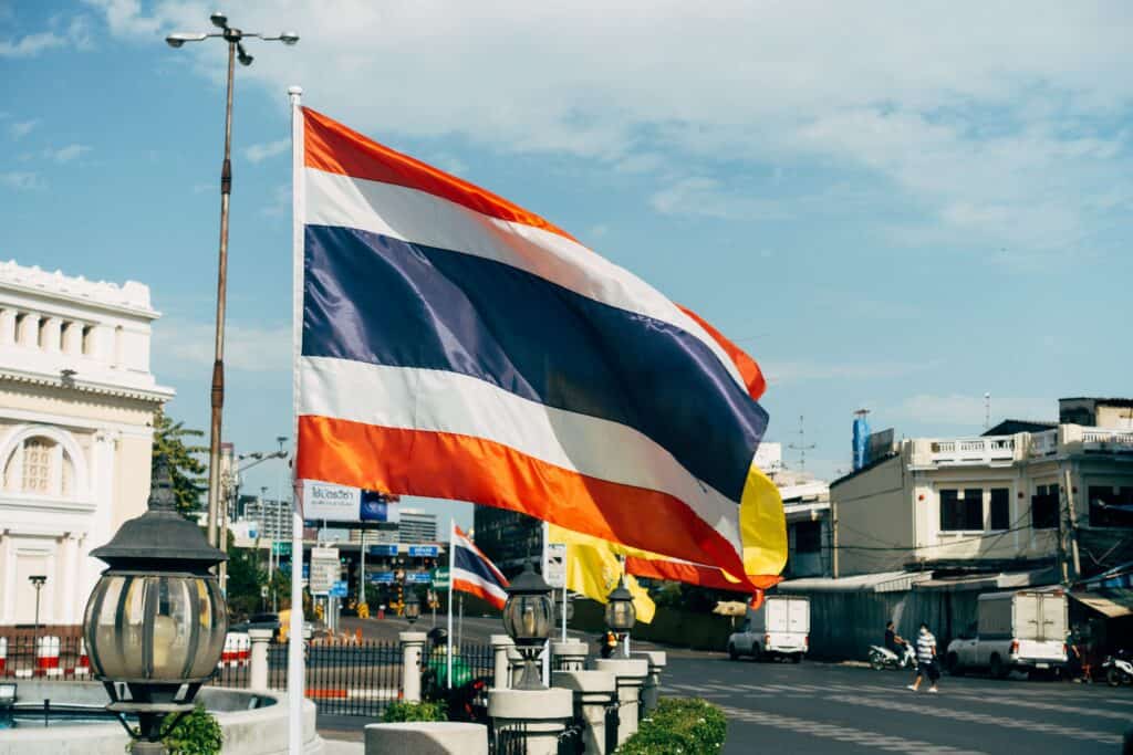 Thai national flag in Bangkok illustrating Thailand for digital nomads tax residency rules
