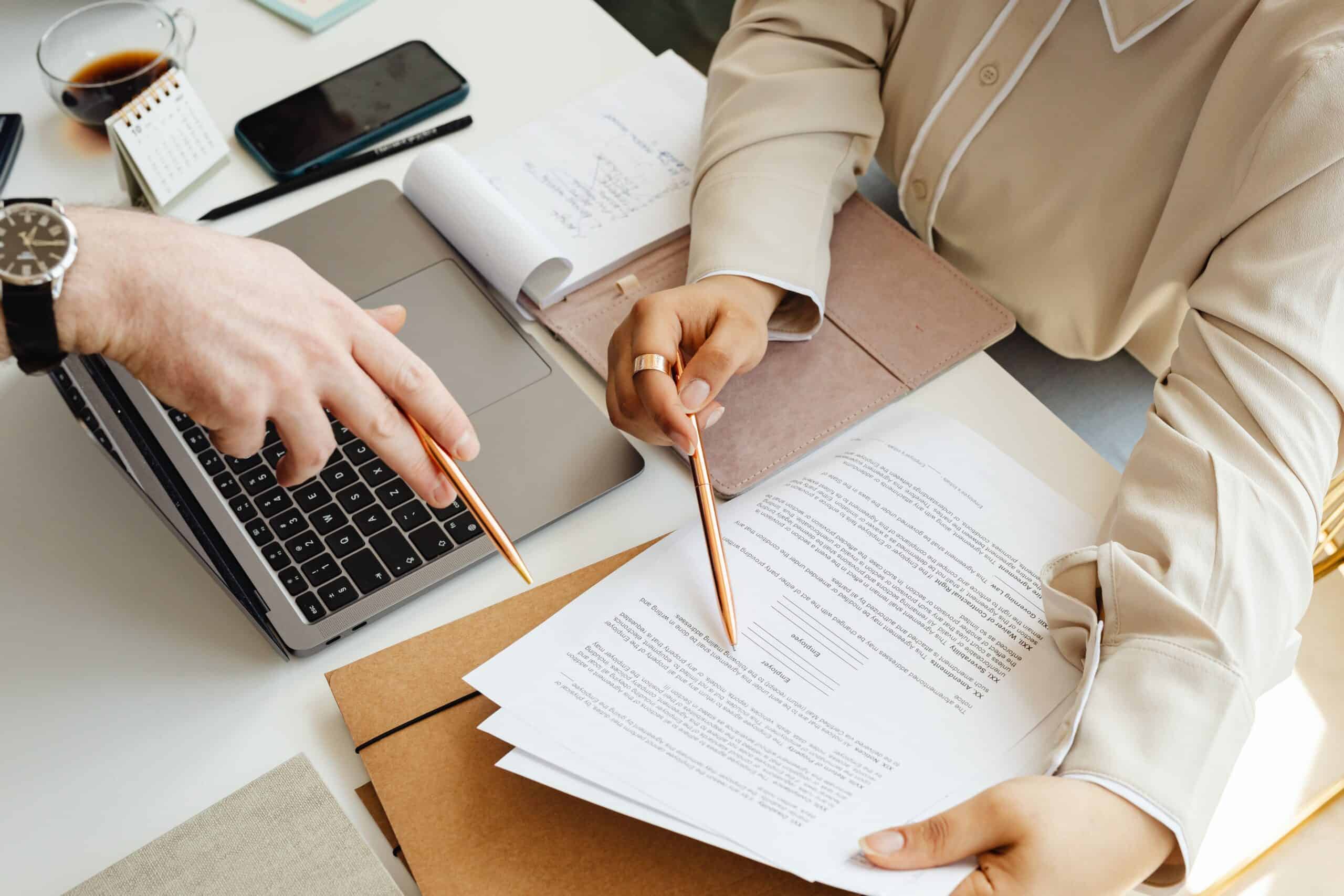 Person handwriting beneficial ownership details required by bank compliance teams
