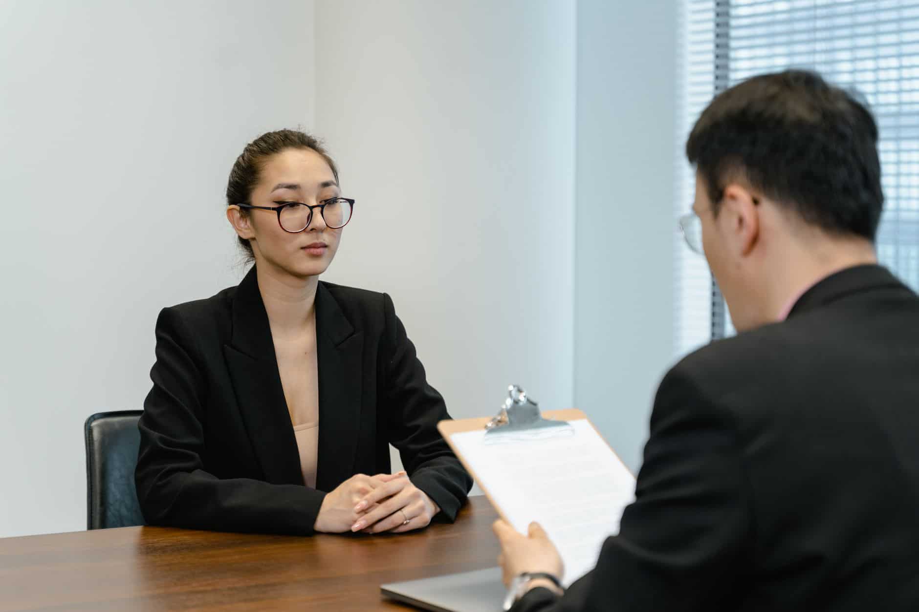 Business professionals in an office interview discussing employment law in Thailand