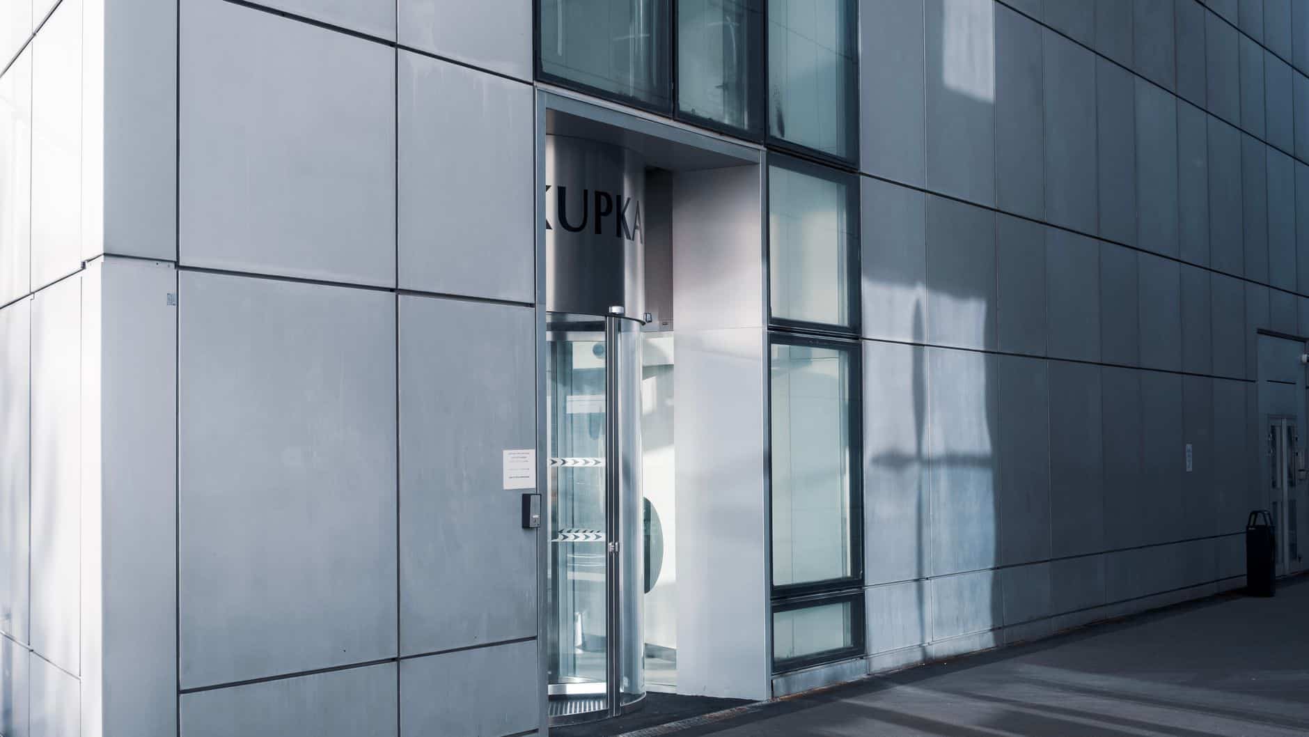 Sleek corporate architecture representing the legal structures behind cross-border tax compliance