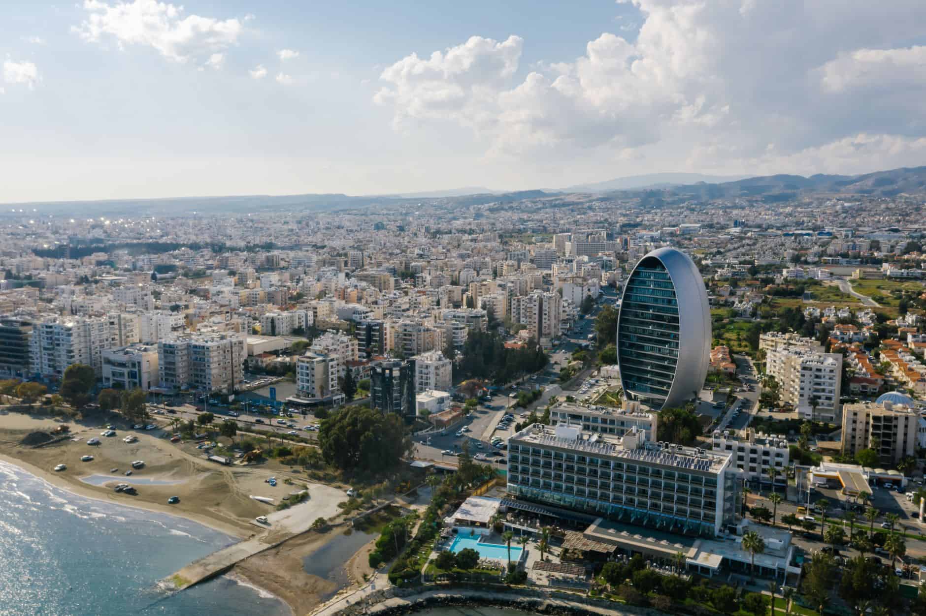 Modern oval building by Limassol seaside representing Cyprus's growing funding ecosystem and capital access