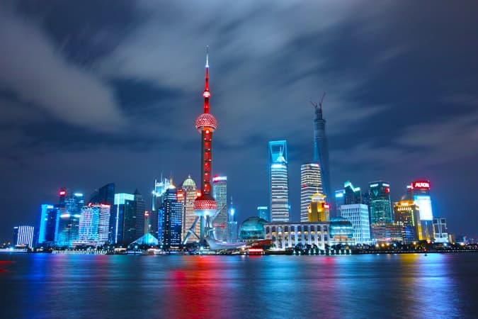 Illuminated city skyline symbolising joint venture partnerships in restricted Chinese sectors