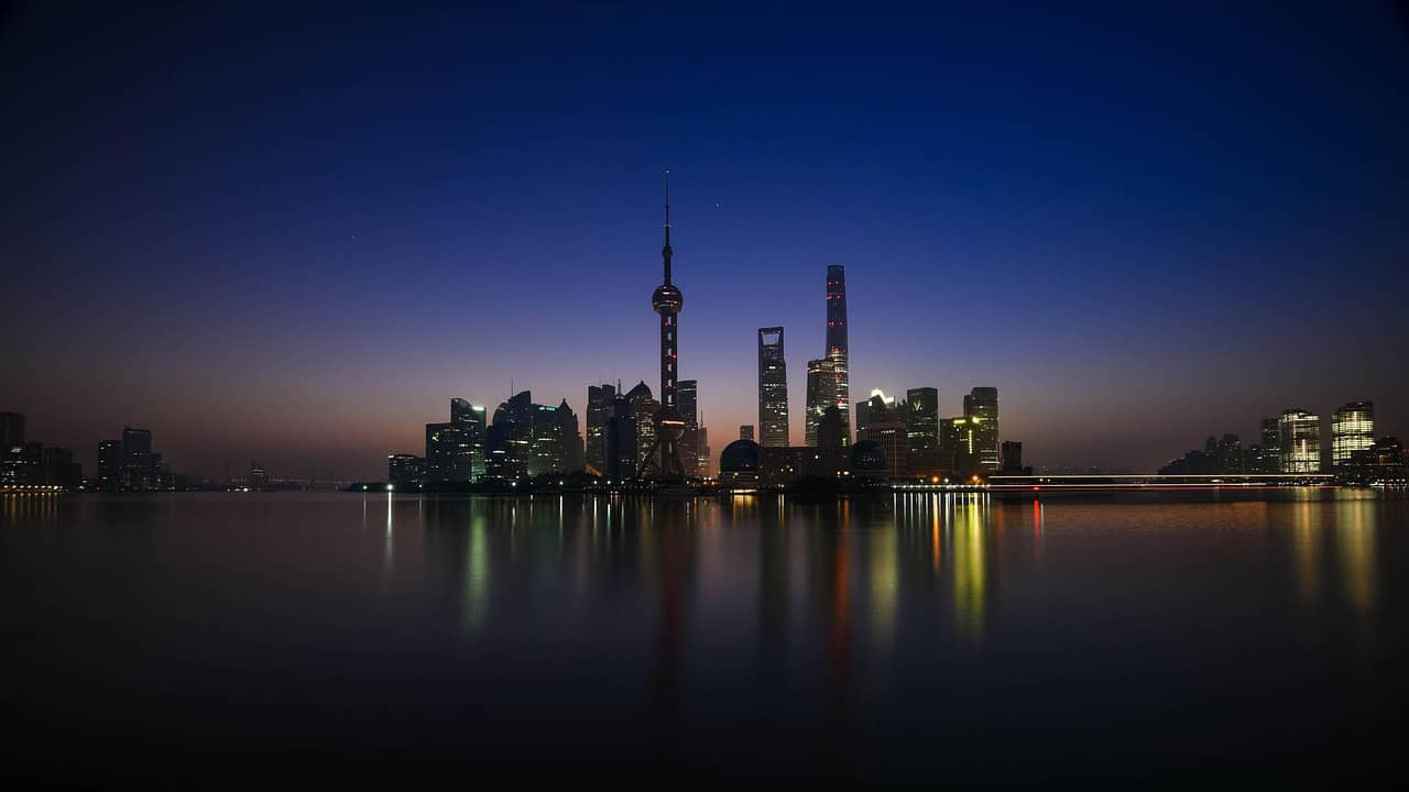 Huangpu River skyline at night reflecting retroactive trust tax rule changes in China