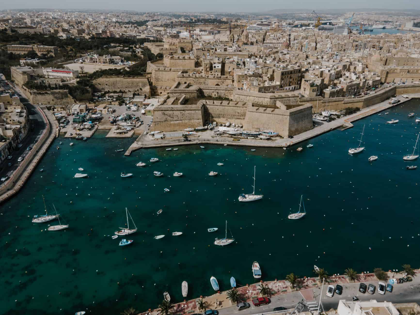 Aerial view of Il-Kalkara harbor guiding entrepreneurs through a 90-day relocation action plan