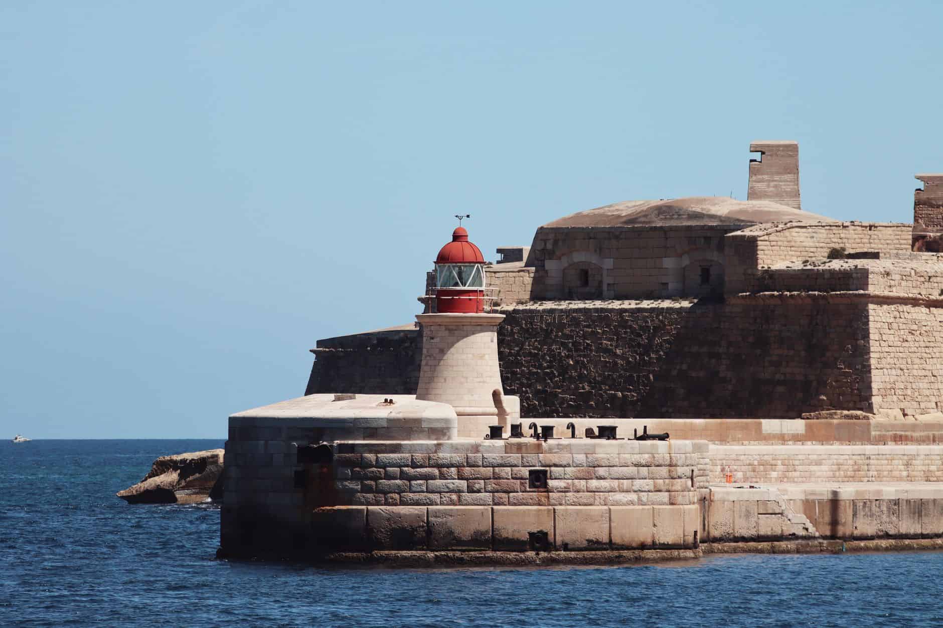Valletta lighthouse and ancient fortifications representing healthcare and family life stability