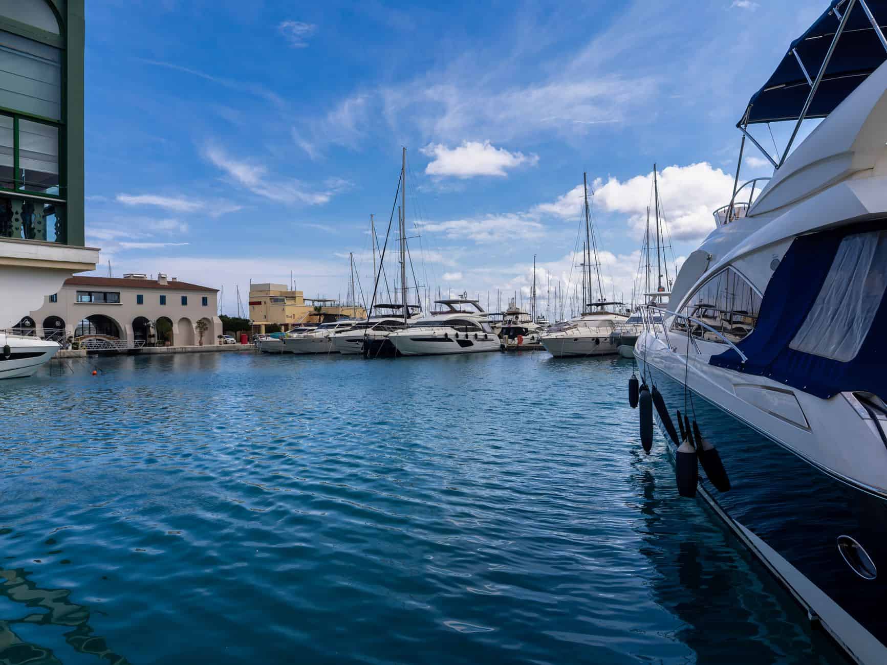 Luxury yachts moored at a Mediterranean marina attracting international entrepreneur residents