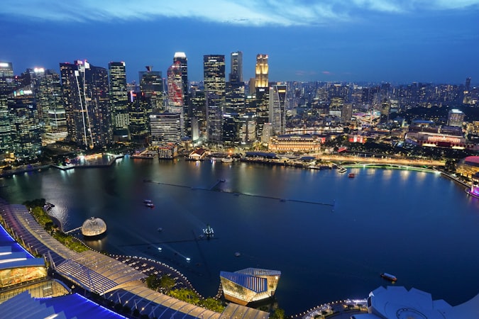 Aerial view of Singapore's CBD at dusk, where corporate compliance duties keep businesses running smoothly