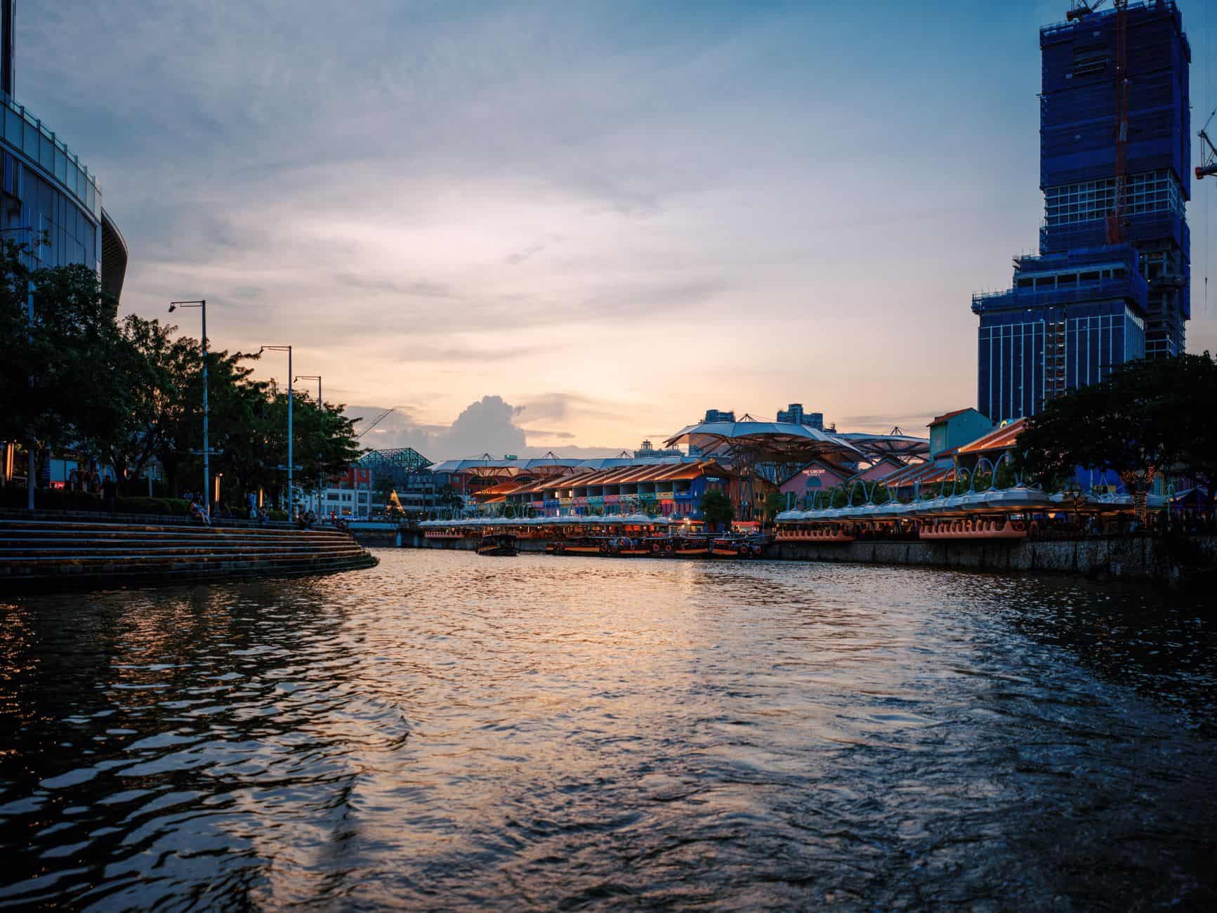 Singapore River at sunset where Work Permit holders support operational and sector-specific roles
