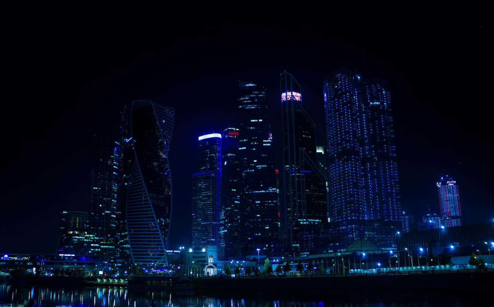 Financial district skyline at night illustrating cross-border VAT compliance for international service businesses