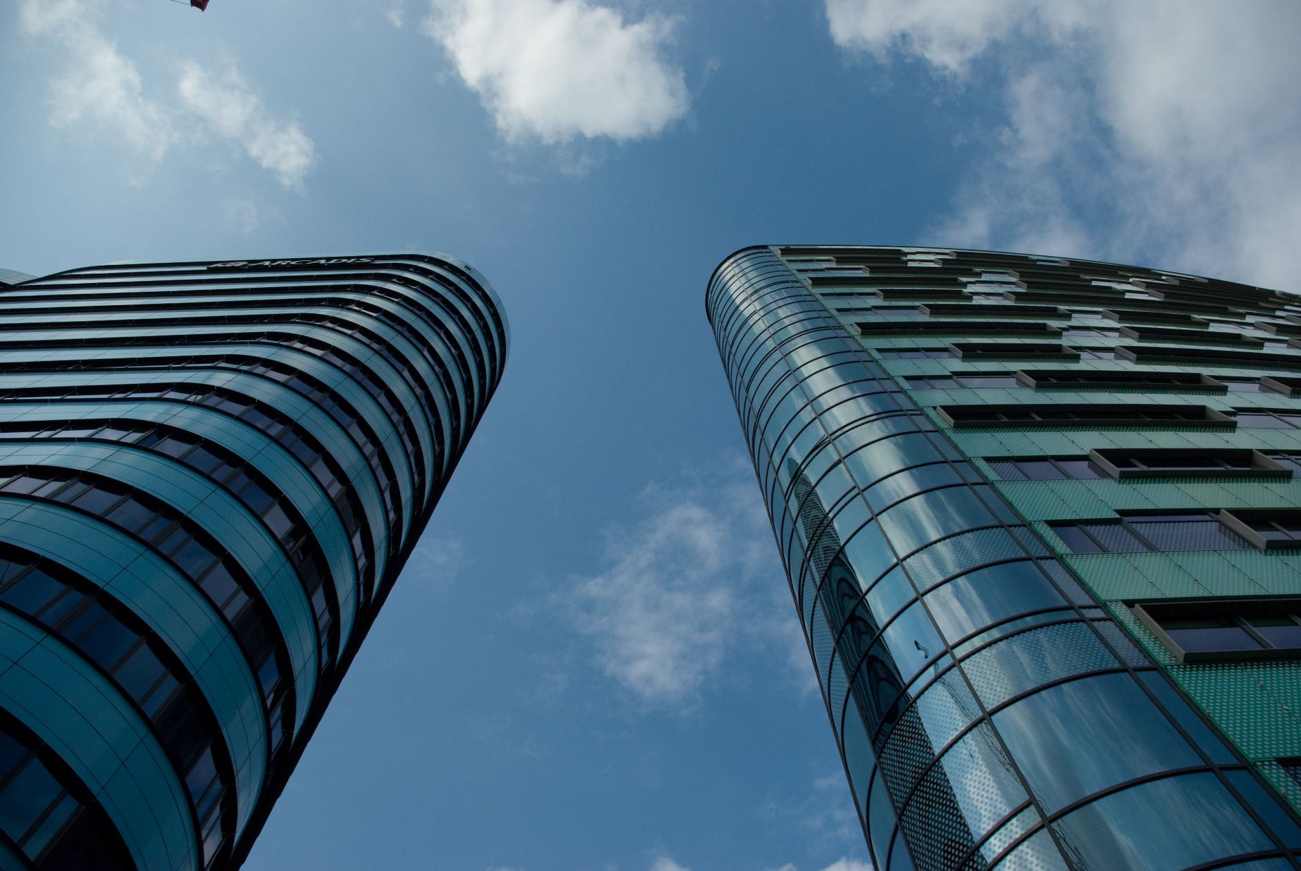 Urban glass skyscrapers illustrating the structural complexity of multinational BEPS-compliant design
