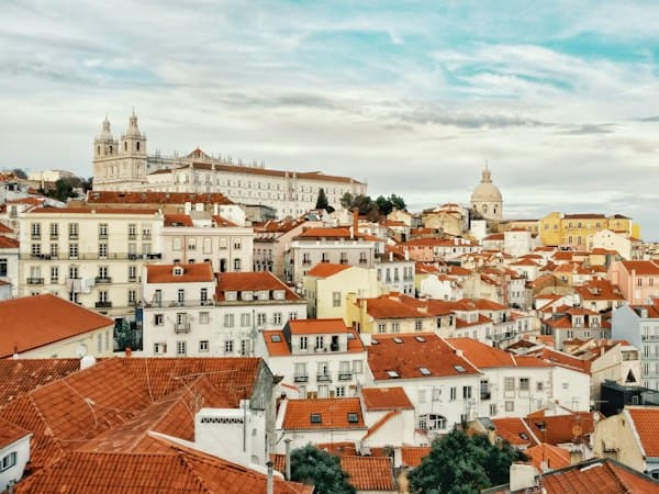 Alfama neighborhood in Lisbon where founders build international teams under Portuguese employment law