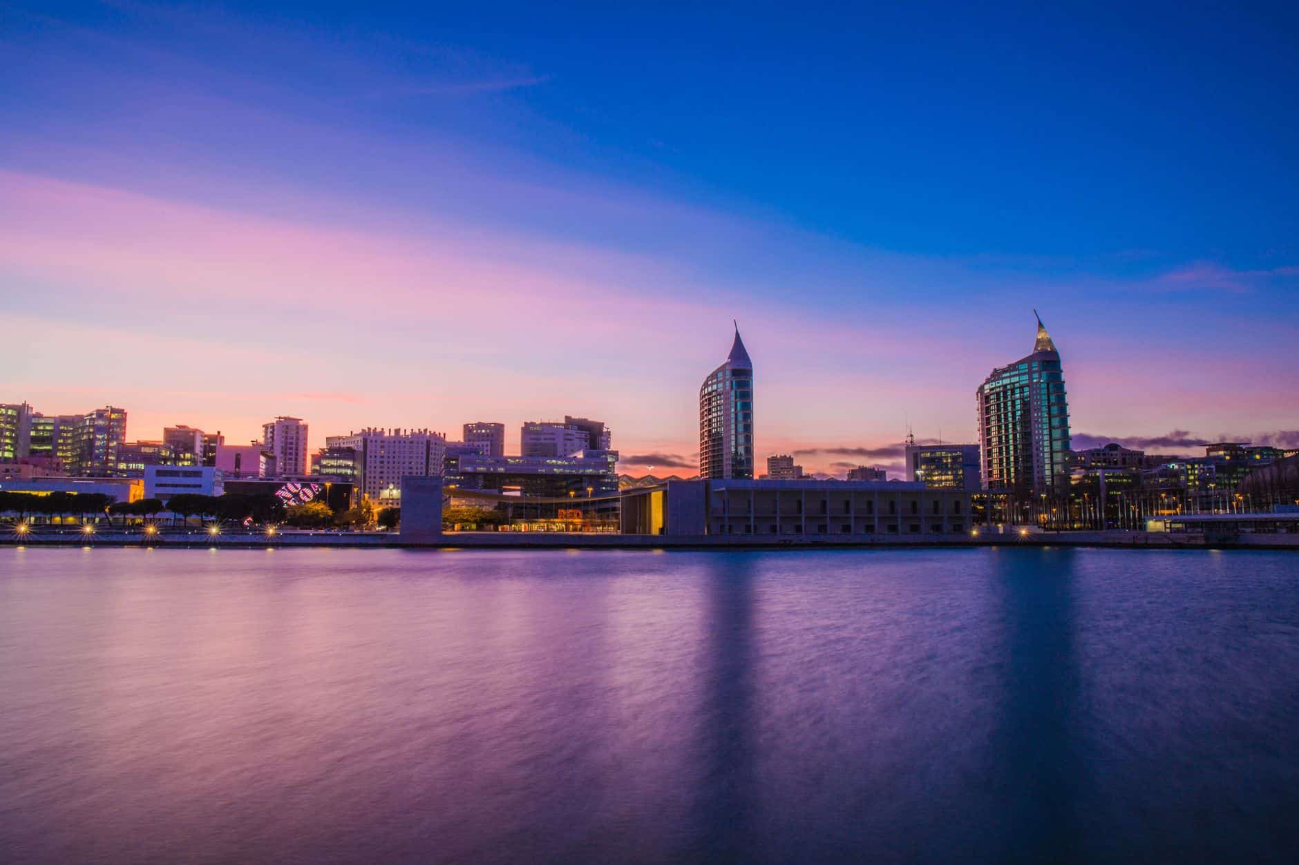 Lisbon waterfront at dusk reflecting the city's modern financial hub for business owners