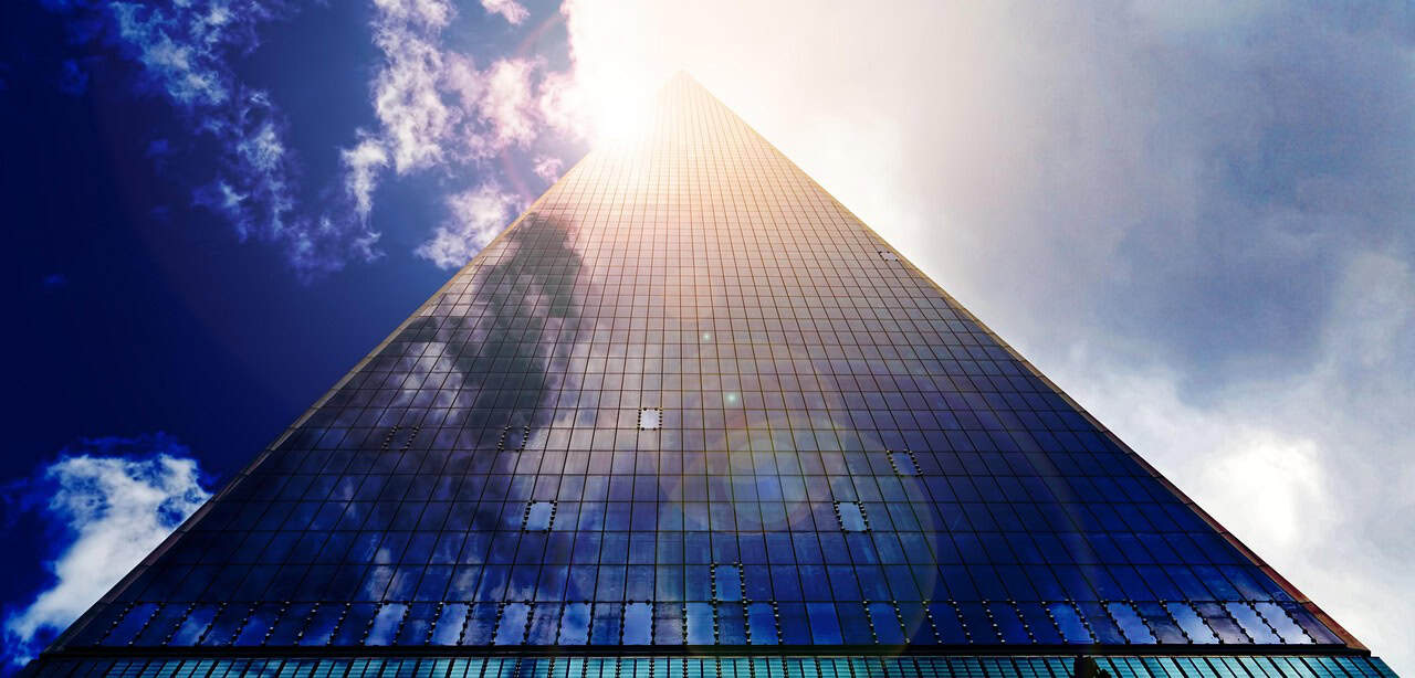 Singapore office tower reflecting sunlight as entrepreneurs apply for local business credit cards