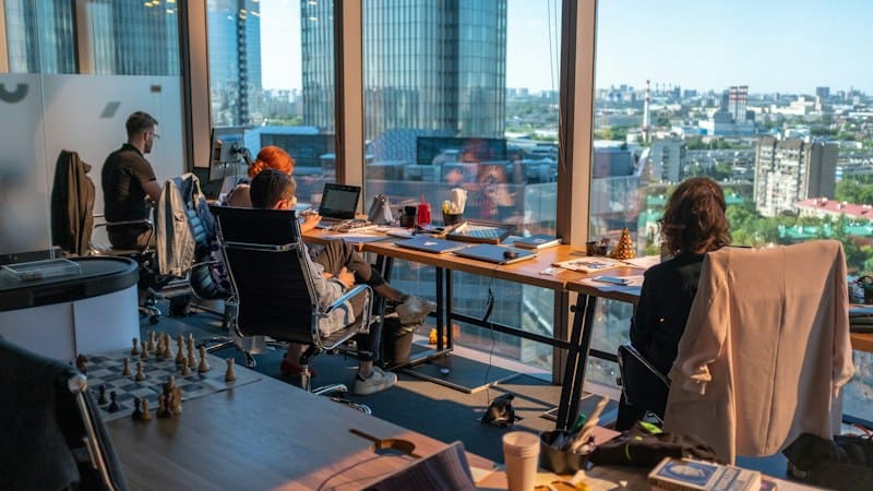 Small team member managing distributed payroll compliance across international jurisdictions