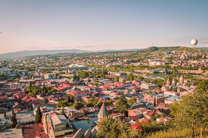 Tbilisi sunset skyline where the Georgia territorial tax system offers tax-free foreign income