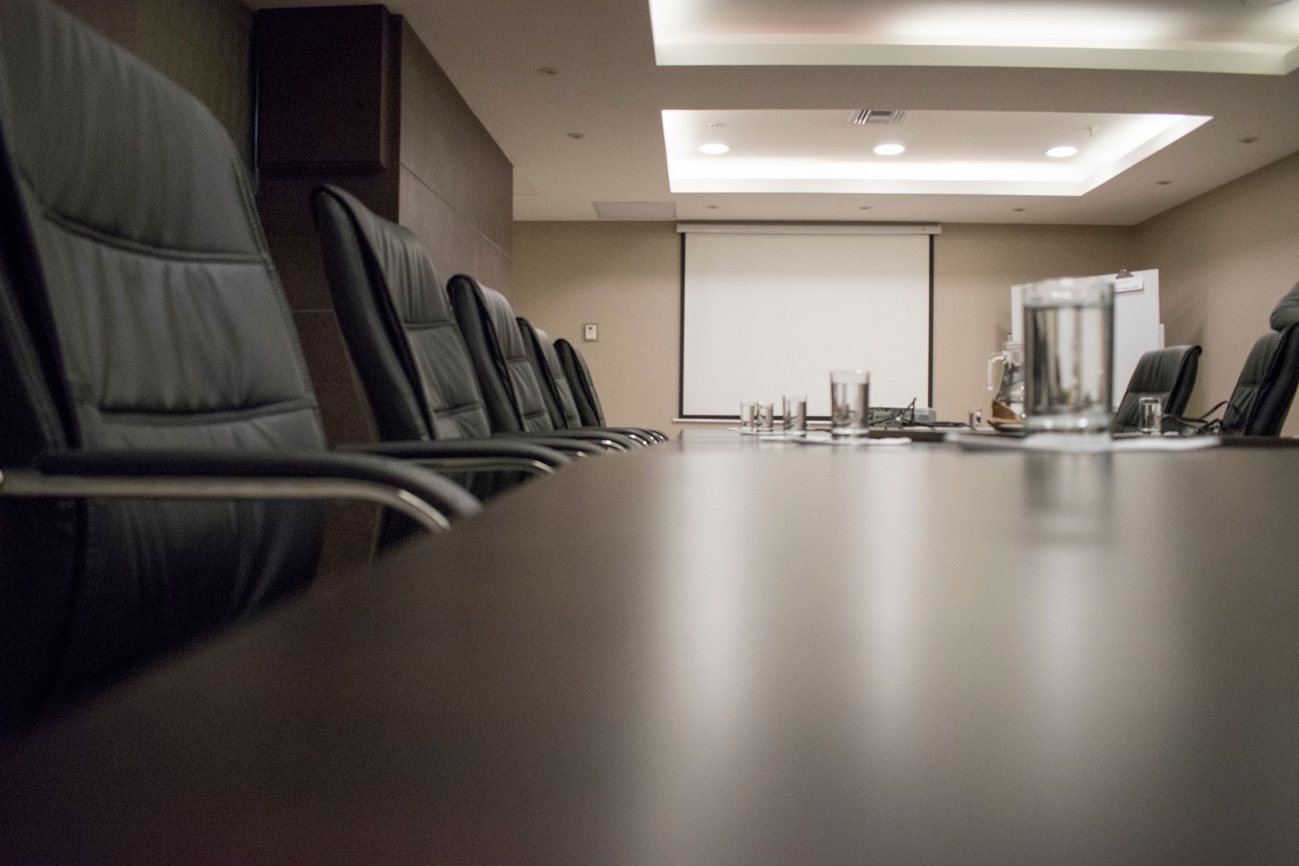 Empty corporate boardroom illustrating governance, substance, and decision-making functions within a group structure