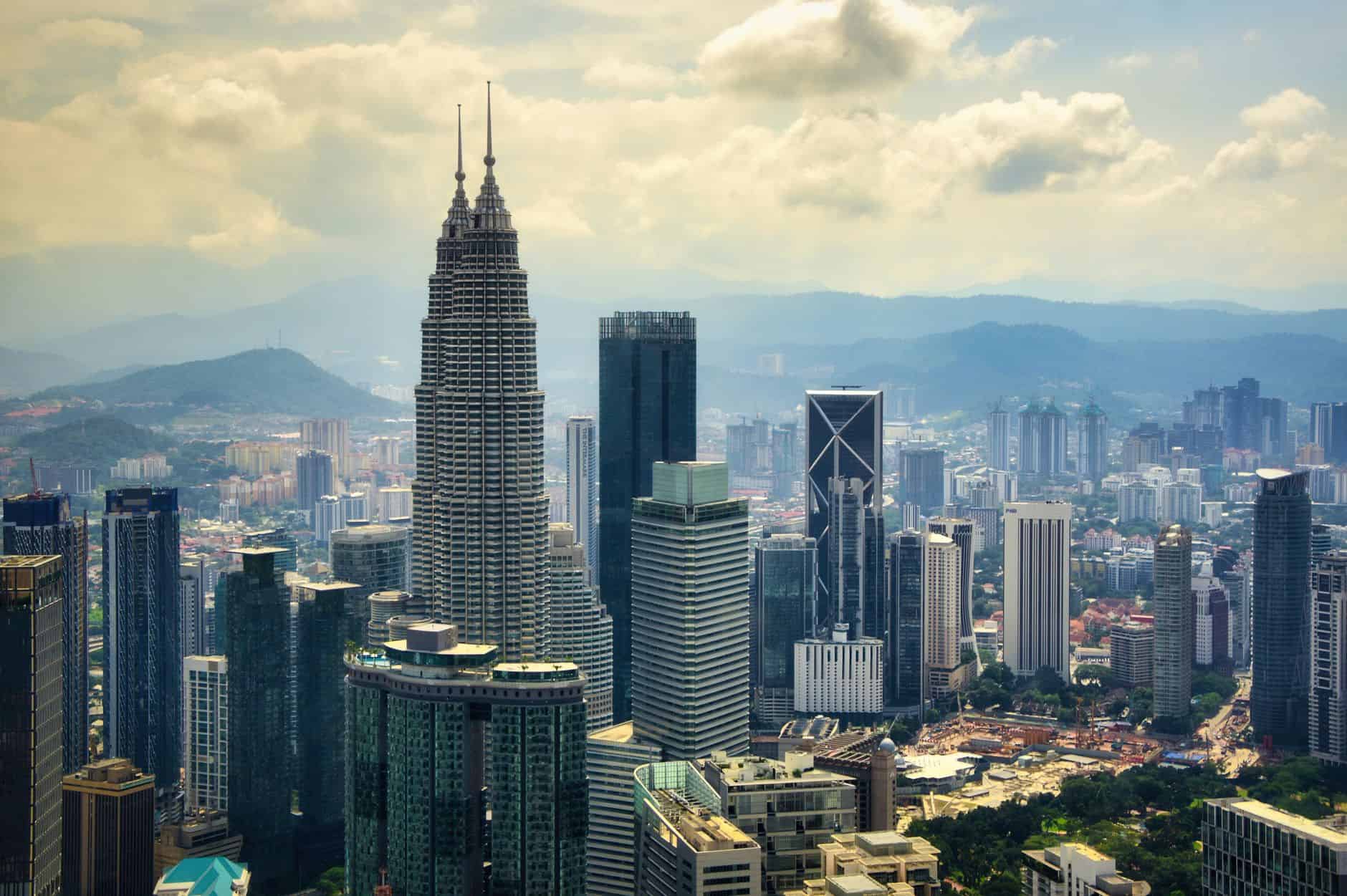 Aerial view of Petronas Towers anchoring Kuala Lumpur's international business district