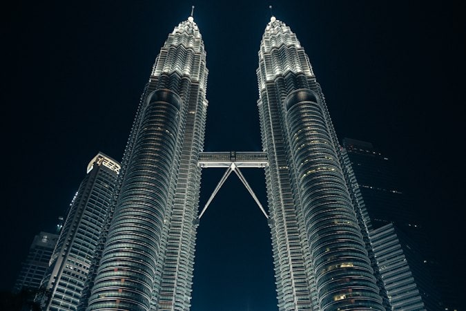 Petronas Tower rising above Kuala Lumpur, home to private hospitals used by expat founders