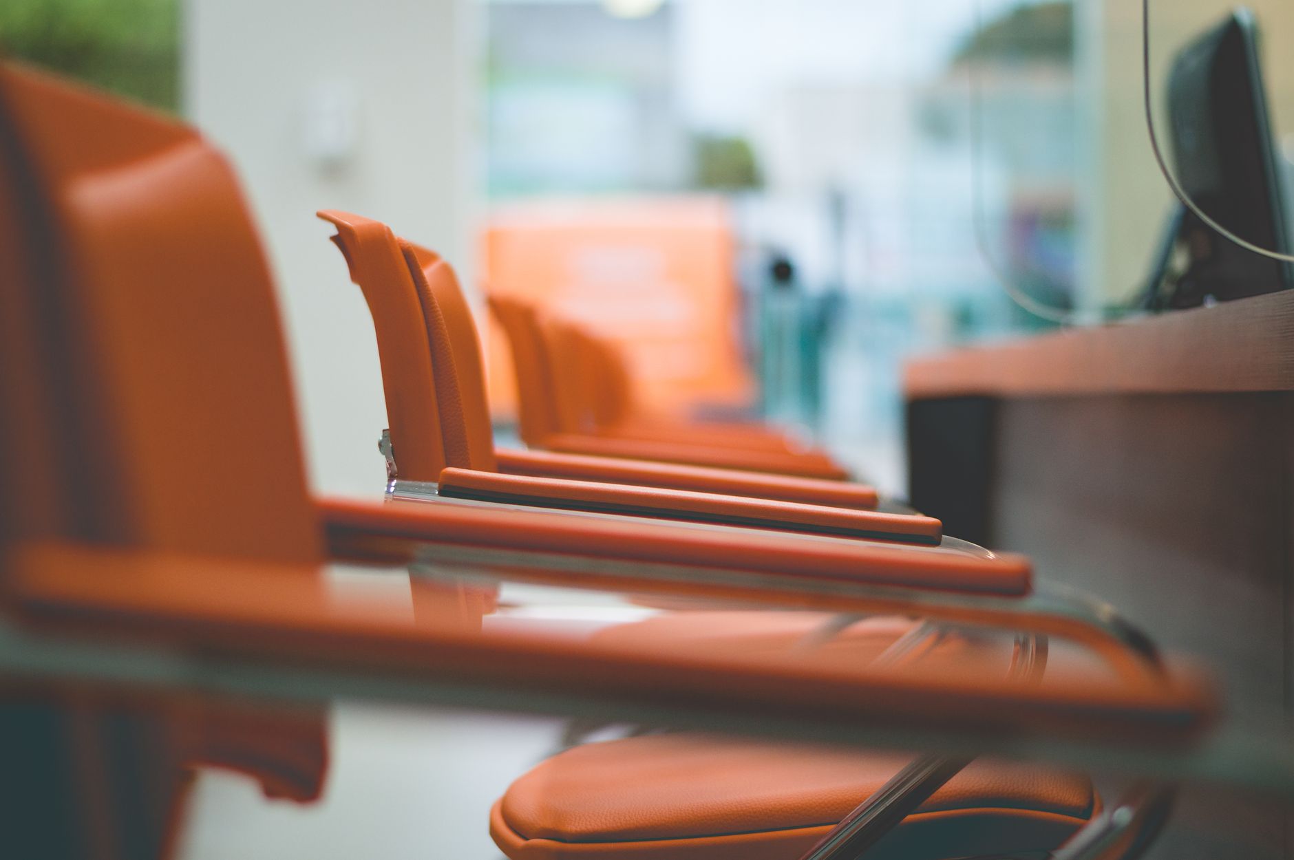 Modern office waiting area chairs symbolizing the choice between PayPal balance and payroll