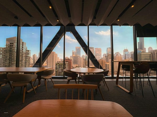 Cafe workspace illustrating EOR vs local entity decision for global employers