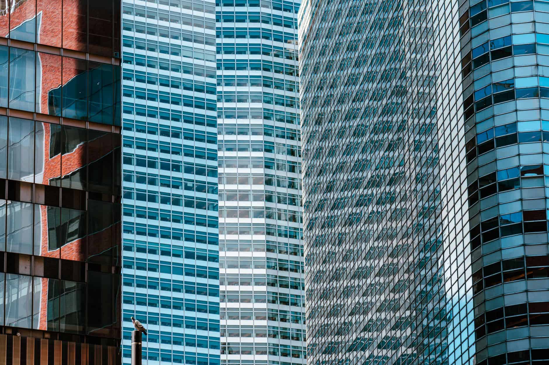 Skyscraper reflections symbolizing the process of building documented Hong Kong substance requirements