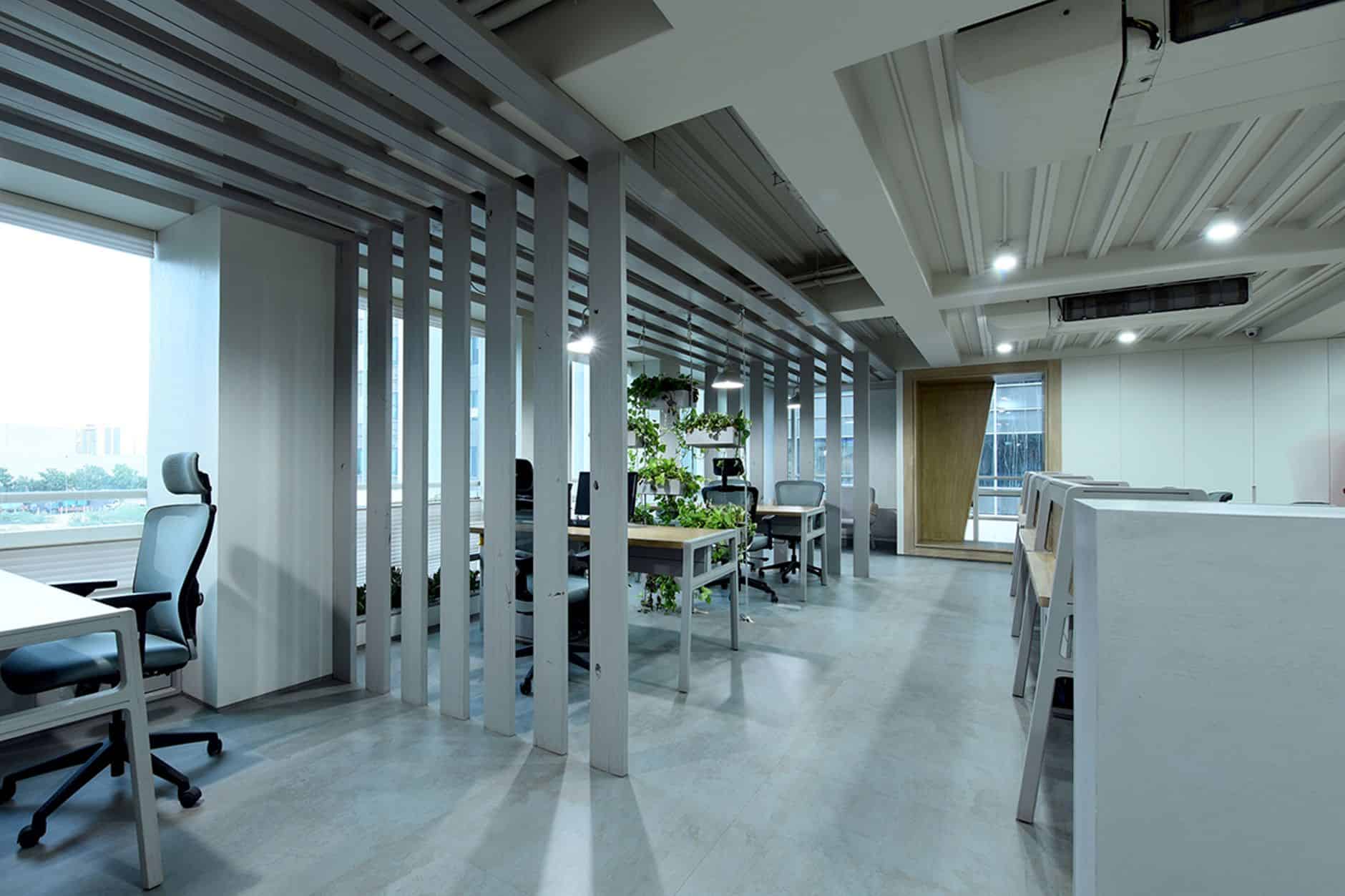 Modern office space highlighting costs, quotas, and tax implications of Singapore work visas