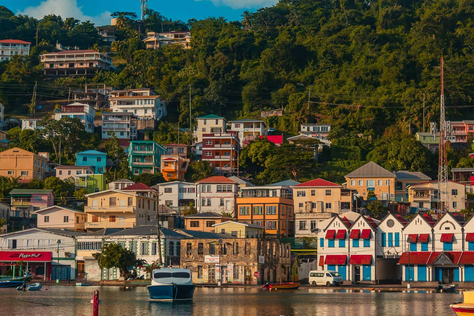Colorful hillside harbor town symbolizing vibrant startup funding ecosystems for foreign founders
